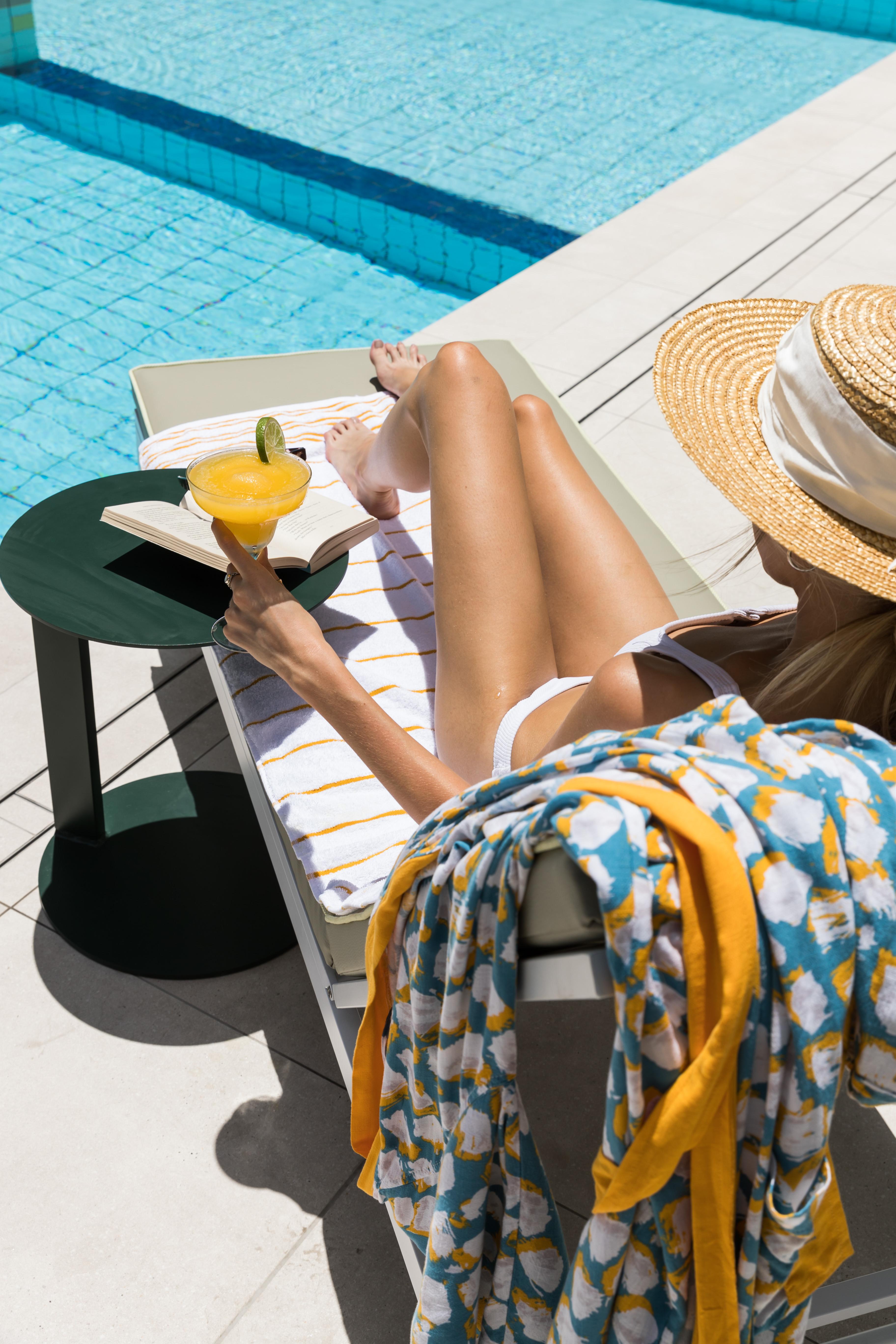Crystalbrook Bailey Hotel Cairns Bagian luar foto A woman sunbathing