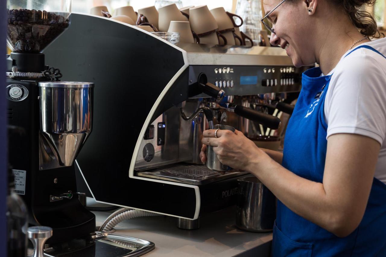 Crystalbrook Bailey Hotel Cairns Bagian luar foto A barista making coffee